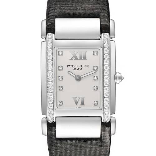 The Patek Philippe Twenty-4 4920G Women's White Gold Silver Dial watch is shown from a top-down angle, highlighting the face, diamond bezel, and part of the strap.