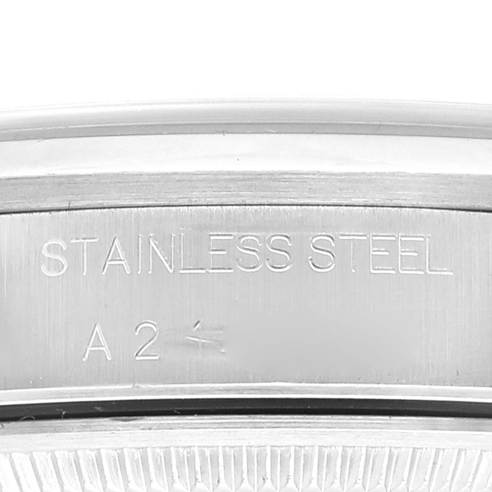 The image shows a close-up of the stainless steel back of a Rolex Air-King 14000 Men's Stainless Steel Black Dial 14000 Men's Stainless Steel Black Dial watch, highlighting the engraving.