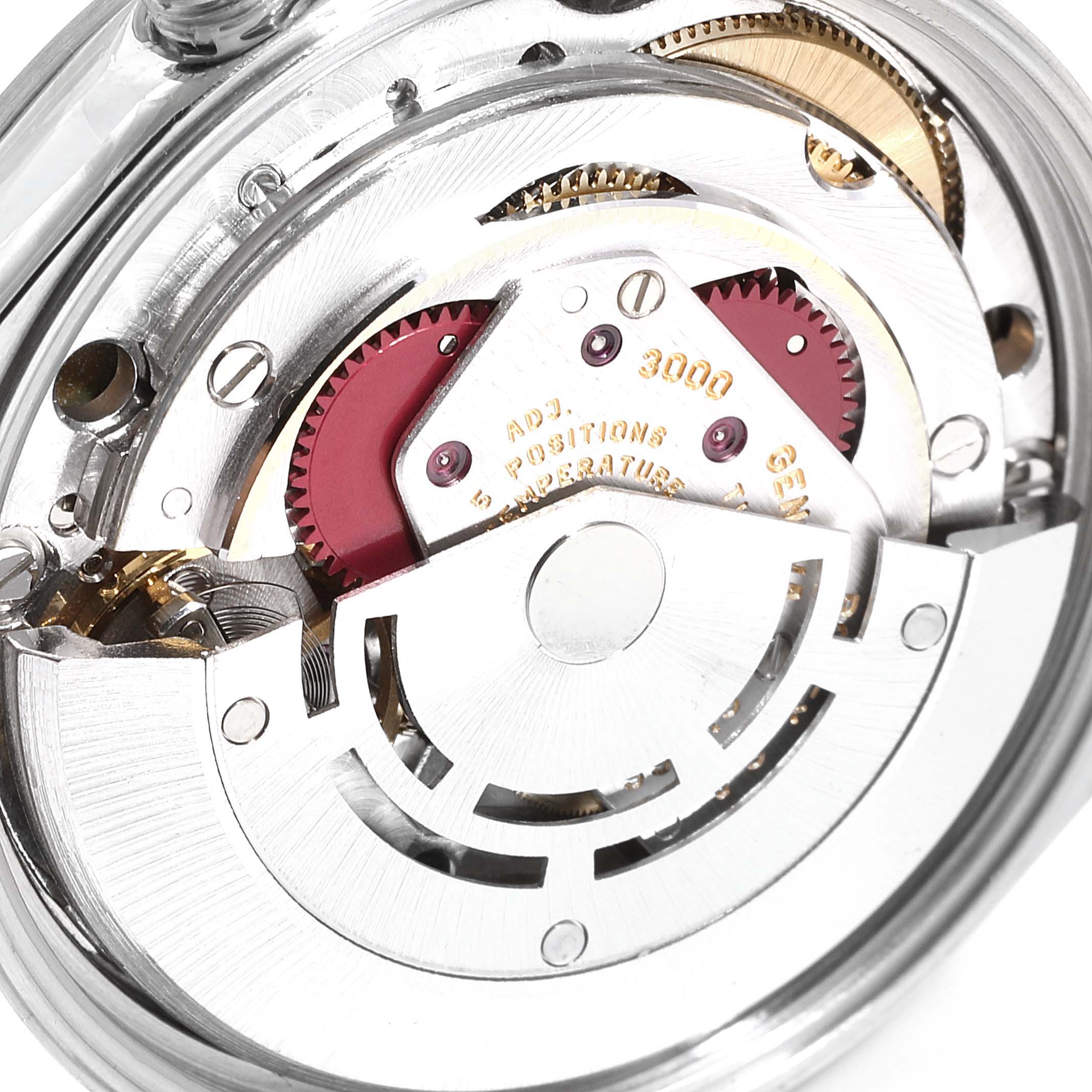 The image shows the internal mechanism of a Rolex Air-King 14000 Men's Stainless Steel Silver Dial 14000 Men's Stainless Steel Silver Dial watch, highlighting the gears and movement components.