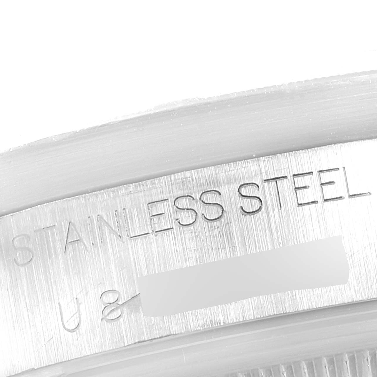 The image shows a close-up of the stainless steel engraving on the case back of a Rolex Air-King 14010 Men's Stainless Steel Silver Dial 14010 Men's Stainless Steel Silver Dial watch.