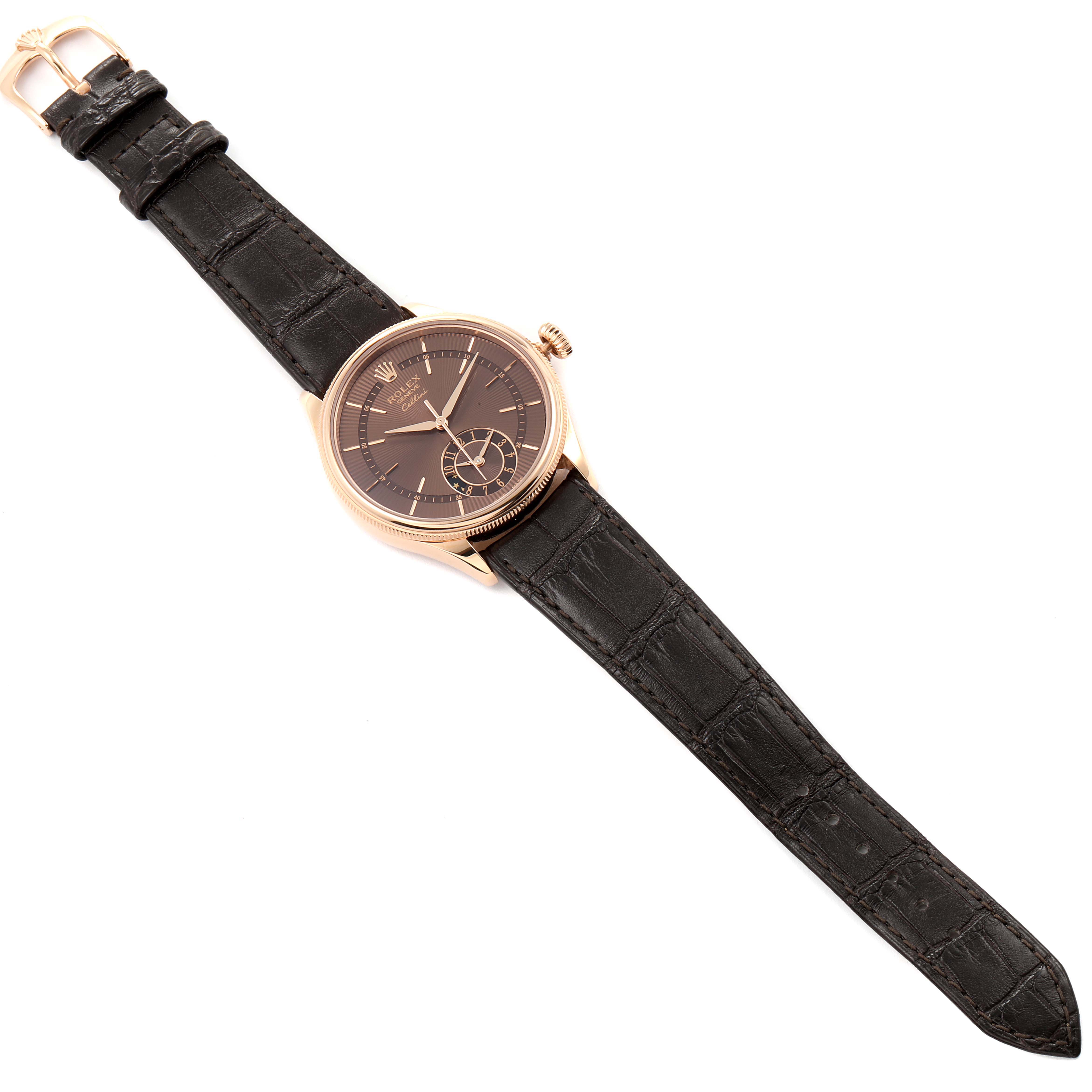 The Rolex Cellini 50525 Men
s Rose Gold Brown Dial 50525 Men
s Rose Gold Brown Dial model watch is shown from a top-down angle, displaying its dark dial, leather strap, and gold case.