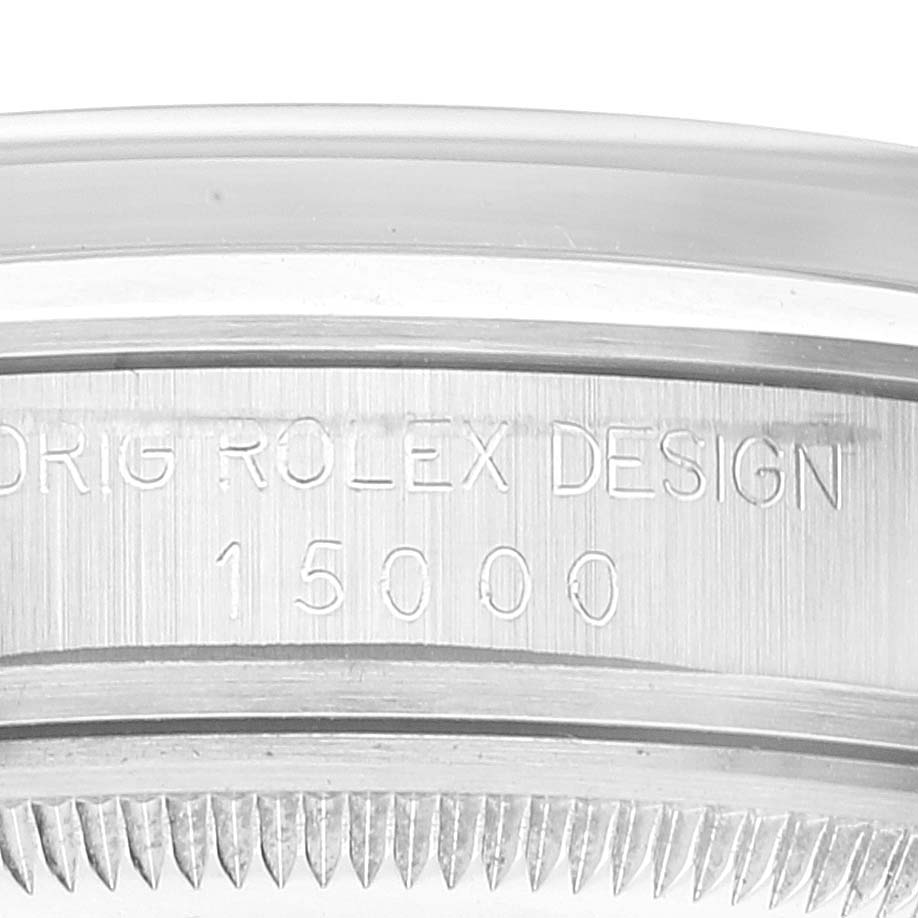The image shows a close-up of the engraved side and band of a Vintage Collection Rolex watch, model number 15000.