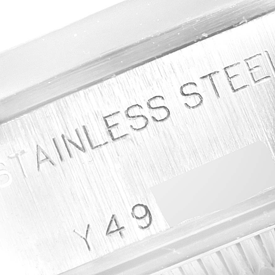 This image shows a close-up of the stainless steel casing engraving on a Rolex Date 79160  Women
s Stainless Steel White Dial 79160  Women
s Stainless Steel White Dial model watch.