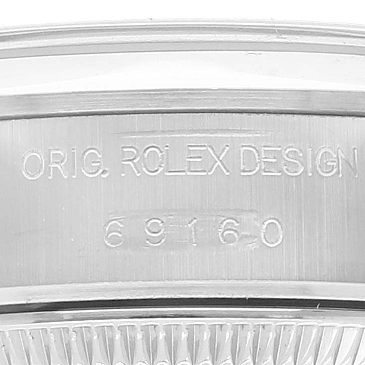 The image shows a close-up of the case back and the reference number of a Rolex Date 69160 Women
s Stainless Steel White Dial 69160 Women
s Stainless Steel White Dial model.