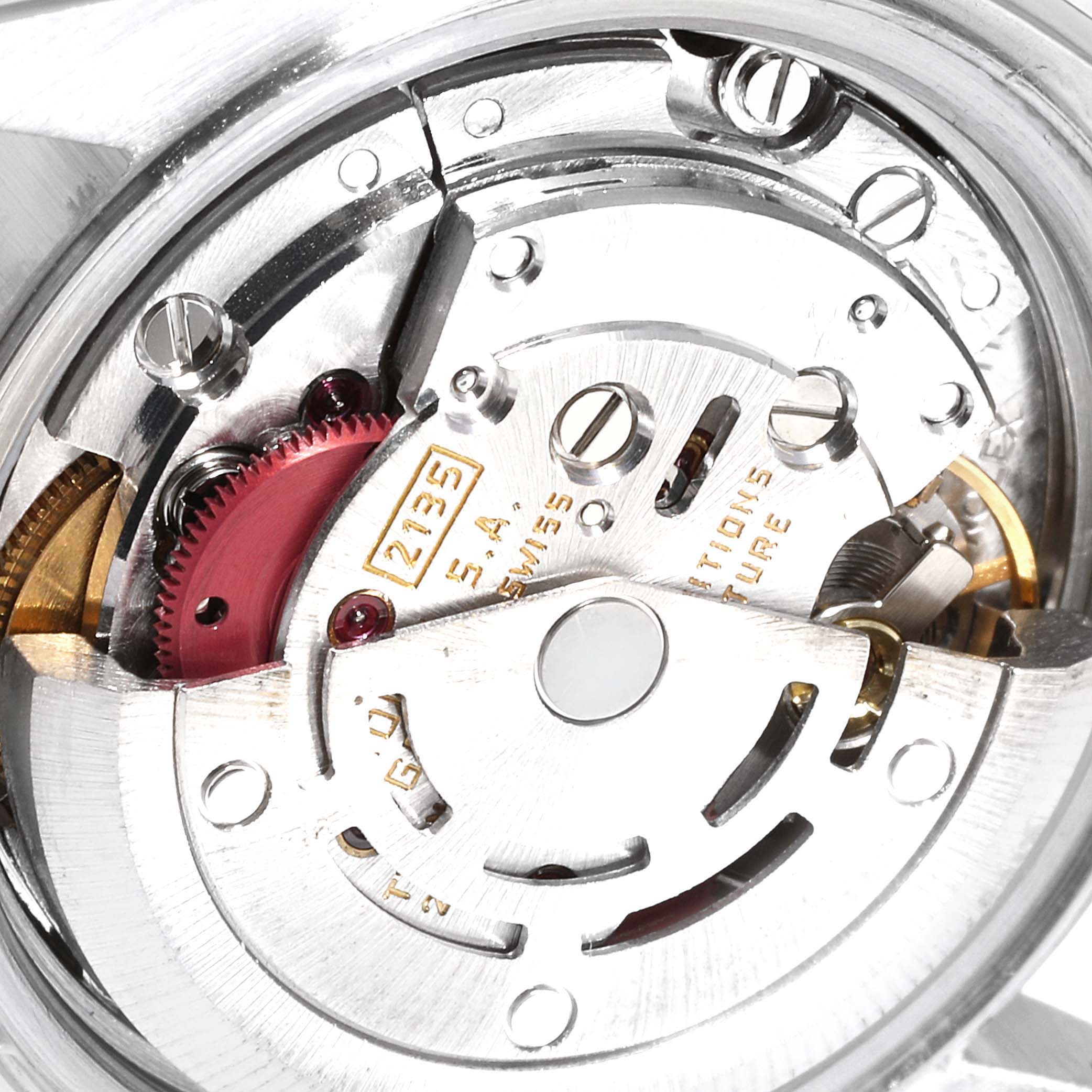 The image shows the internal mechanism of a Rolex Datejust 69173 Women
s Steel and Gold (two tone) Champagne Dial 69173 Women
s Steel and Gold (two tone) Champagne Dial watch, focusing on its automatic movement components.