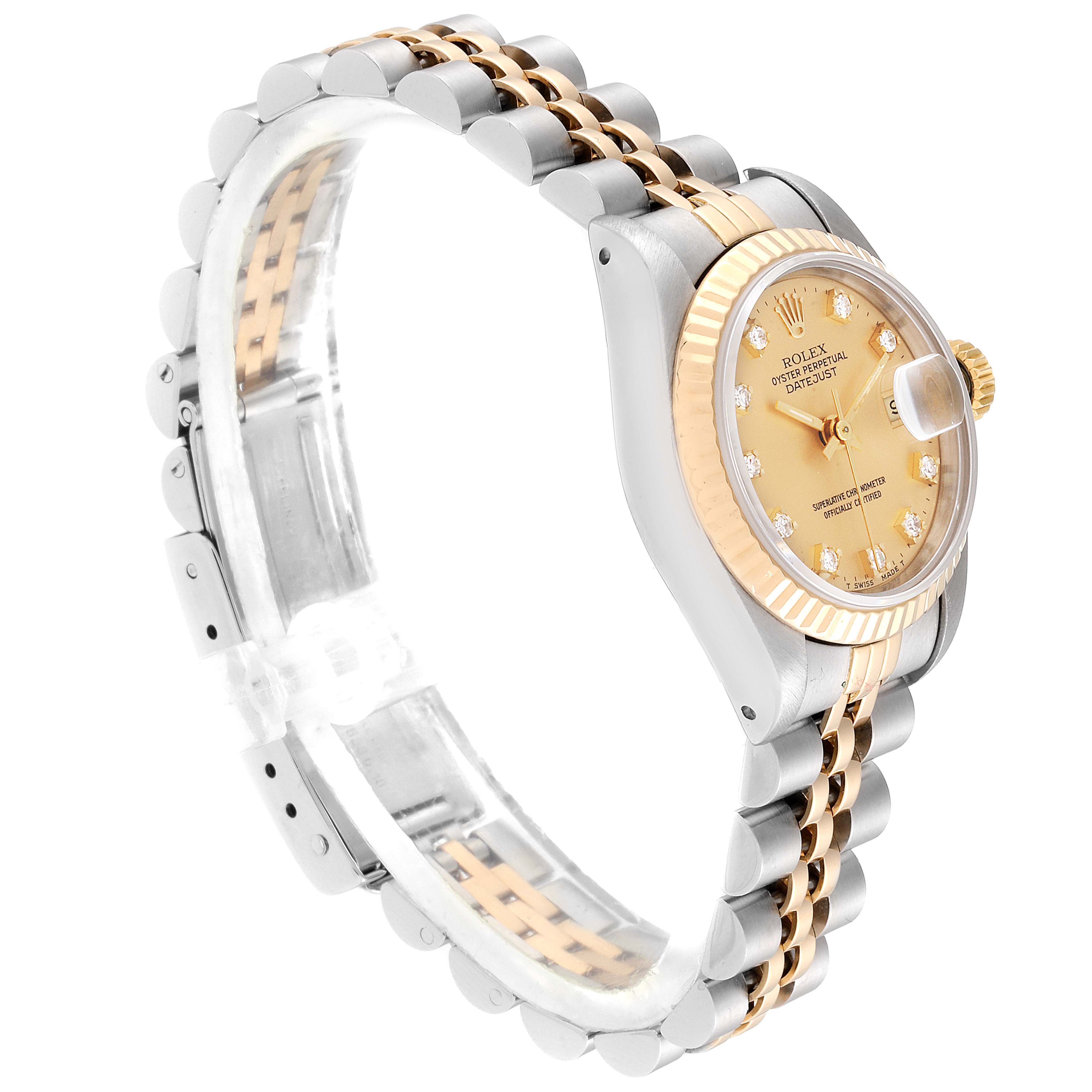 The image shows a Rolex Datejust 69173 Women
s Steel and Gold (two tone) Champagne Dial 69173 Women
s Steel and Gold (two tone) Champagne Dial wristwatch from a side angle, highlighting the dial, fluted bezel, and two-tone bracelet.