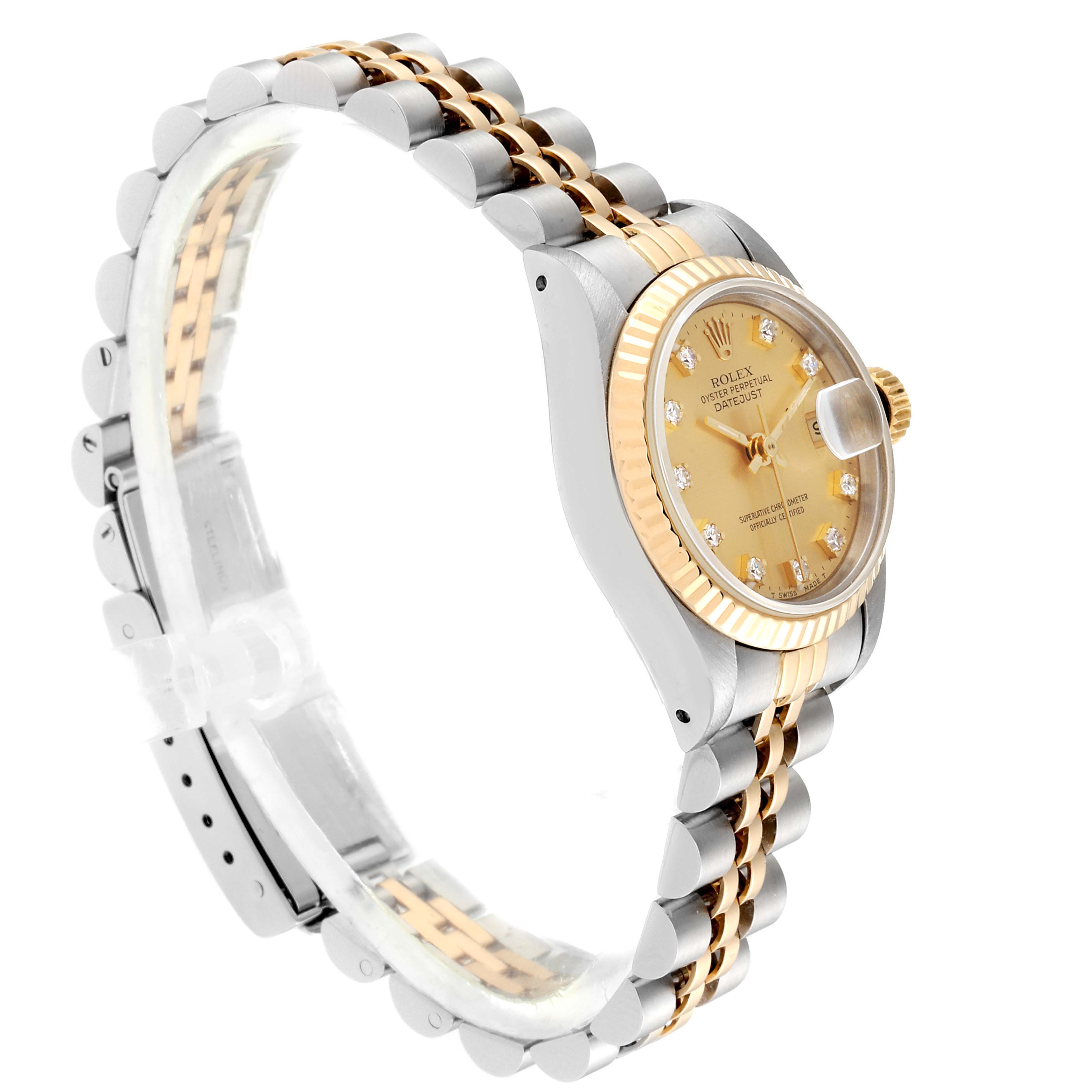 The image shows a side view of the Rolex Datejust 69173 Women
s Steel and Gold (two tone) Champagne Dial 69173 Women
s Steel and Gold (two tone) Champagne Dial watch, highlighting its face, fluted bezel, and two-tone bracelet.