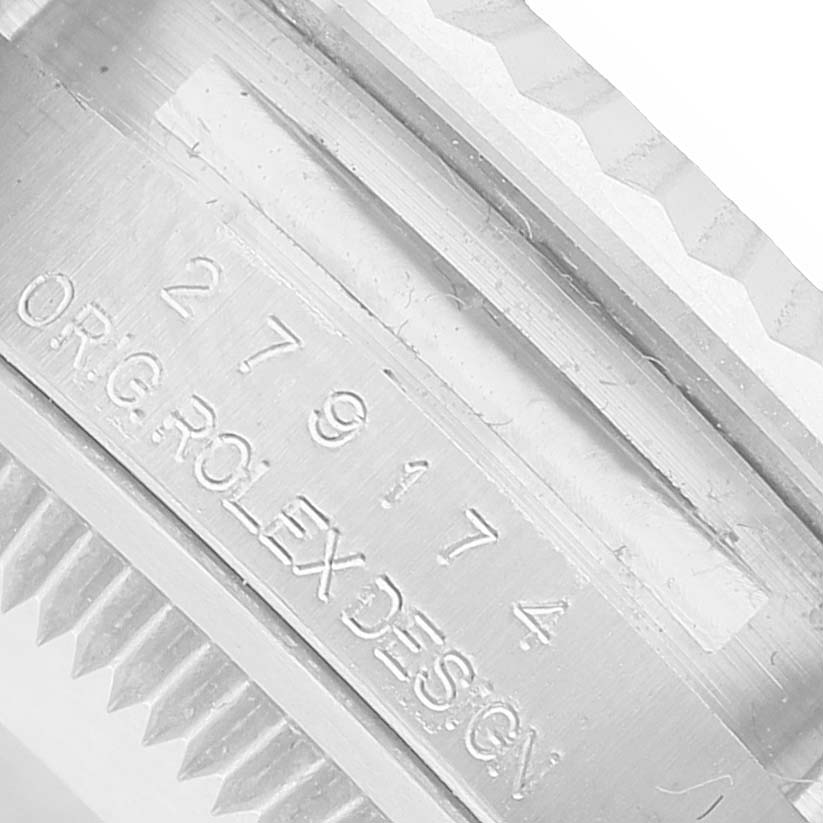The image shows a close-up of the Rolex Datejust 279174 Women's Stainless Steel White Dial's engraved inner case section at an angled view.
