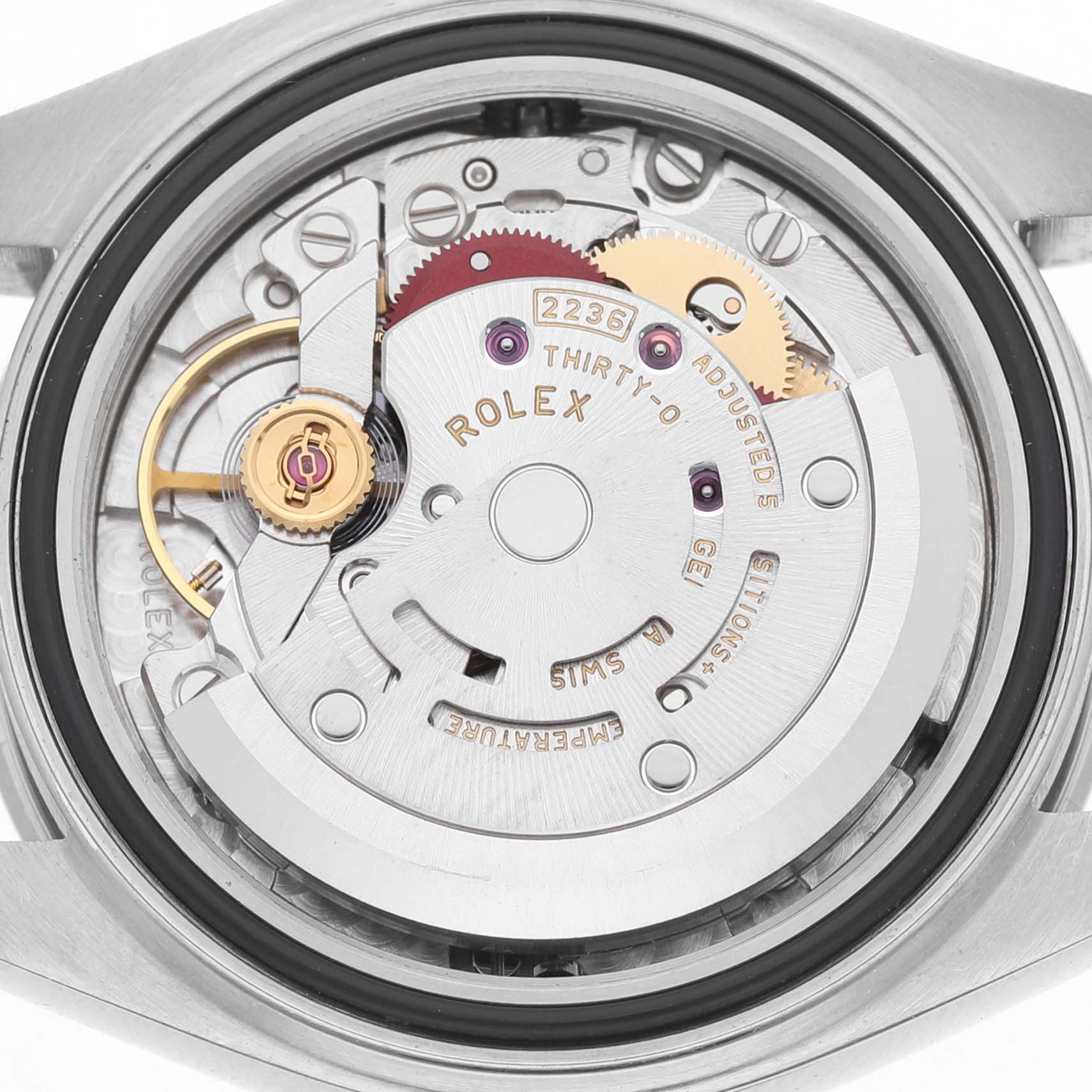 The image shows the exposed movement of a Rolex Datejust 279174 Women's Stainless Steel Silver Dial, highlighting its intricate internal mechanisms.