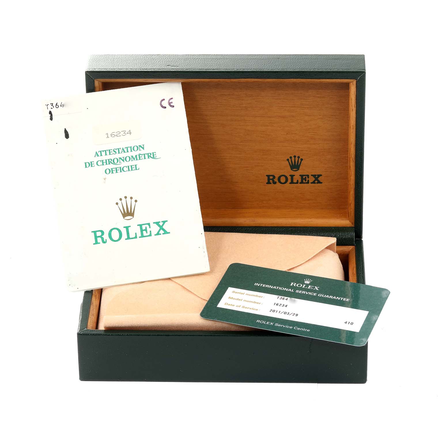 The image shows the open packaging for a Rolex Datejust 16234 Men's Stainless Steel Black Dial 16234 Men's Stainless Steel Black Dial model, including documentation and a service guarantee card.