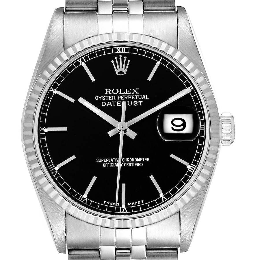 The image shows a front view of a Rolex Datejust watch, highlighting its black dial, fluted bezel, and metal bracelet.