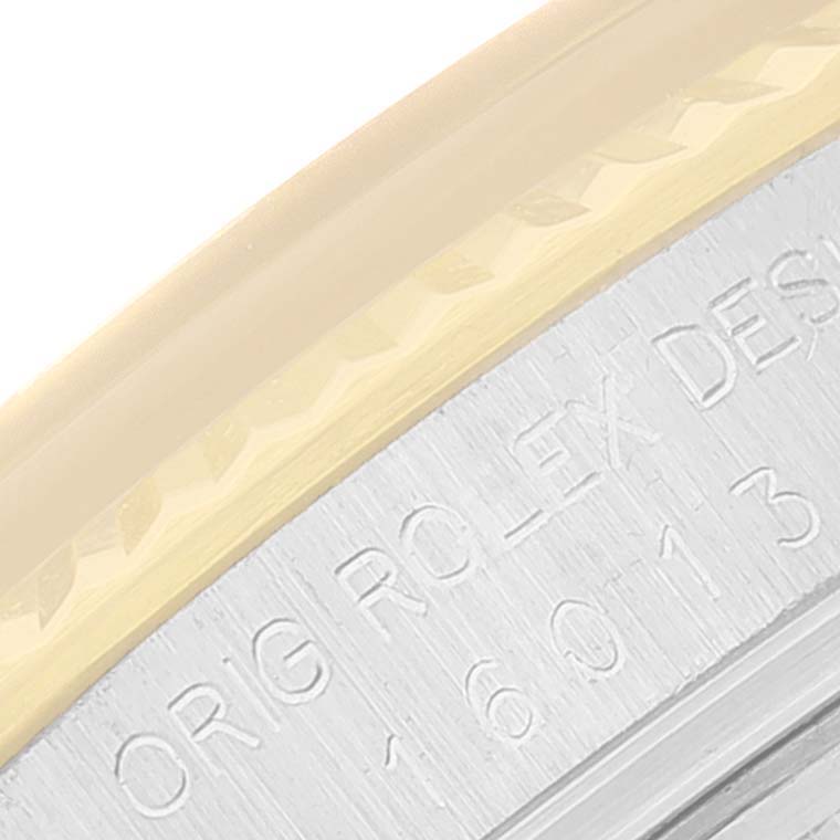 This image shows a close-up of the watch rim engraving on a Vintage Collection model by Rolex.