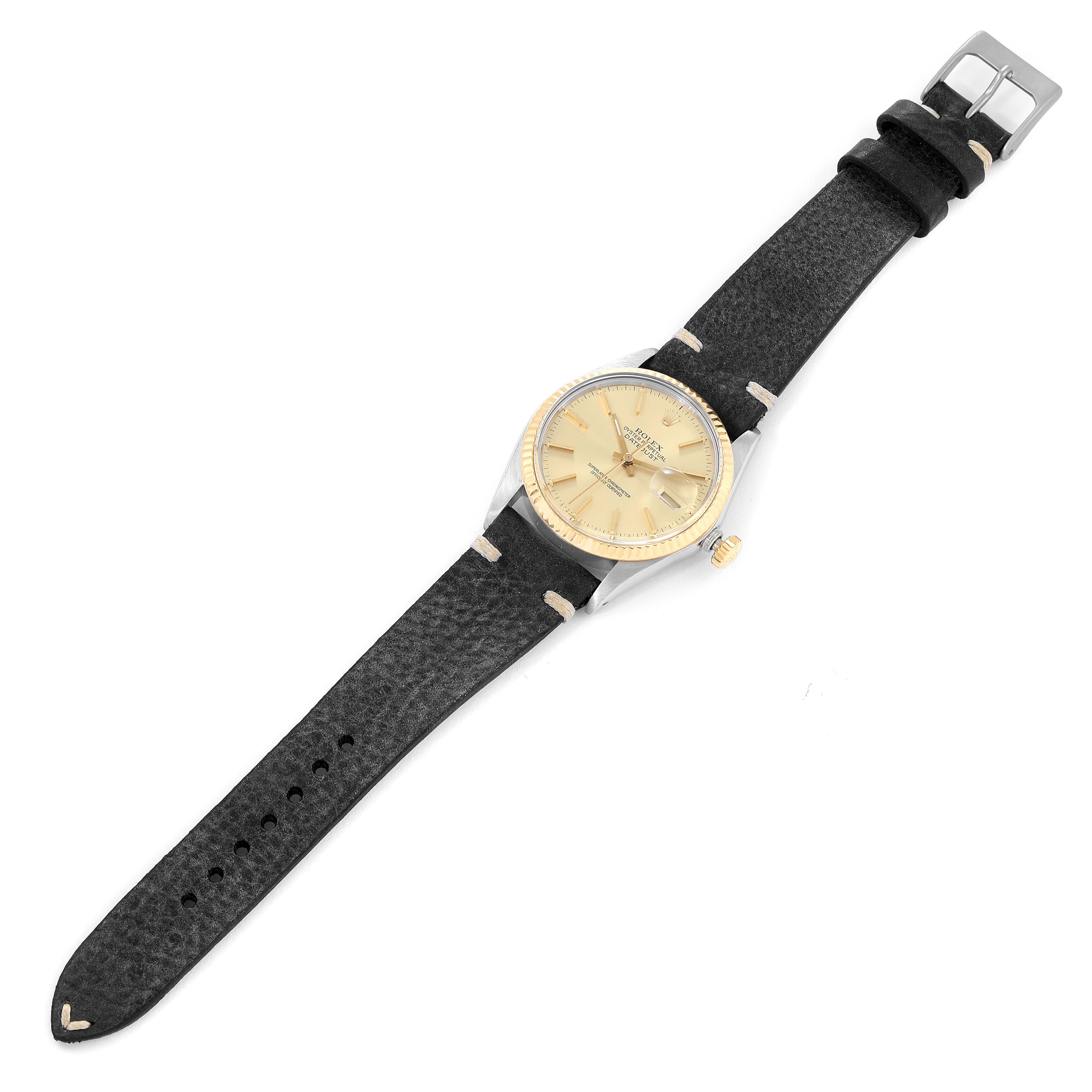 The Rolex Vintage Collection 16013 Men's Steel and Gold (two tone) Champagne Dial 16013 Men's Steel and Gold (two tone) Champagne Dial model is shown from a top-down angle, displaying the entire watch face, case, and strap.