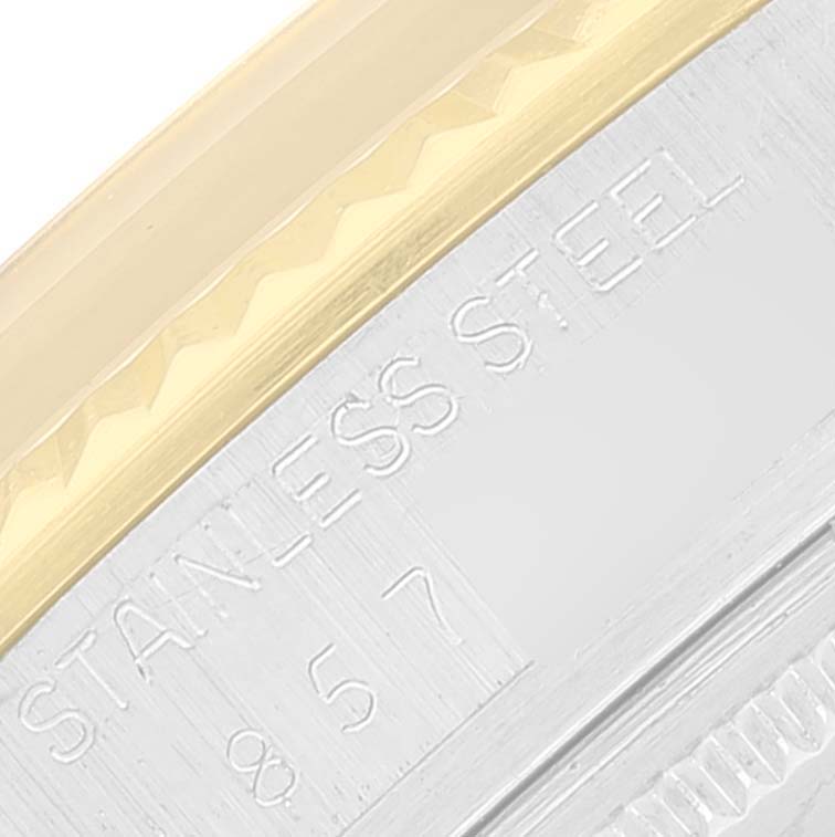 This close-up image shows the engraved "STAINLESS STEEL" marking on the bezel of a Vintage Collection Rolex watch.