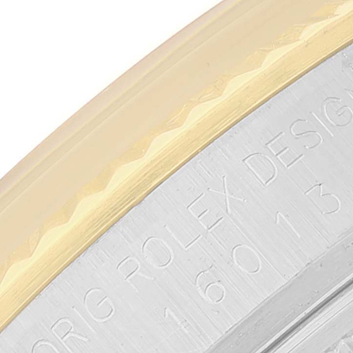 The image shows a close-up of the side of a Rolex Vintage Collection 16013 Men's Steel and Gold (two tone) Champagne Dial 16013 Men's Steel and Gold (two tone) Champagne Dial watch, highlighting the engraved text on the case.