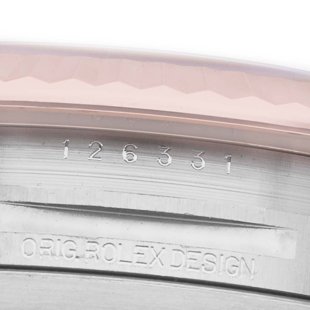 The image shows the side of the Rolex Datejust 41 126331 Men's Steel and Gold (two tone) Pink Dial, focusing on the engraved model and design number.