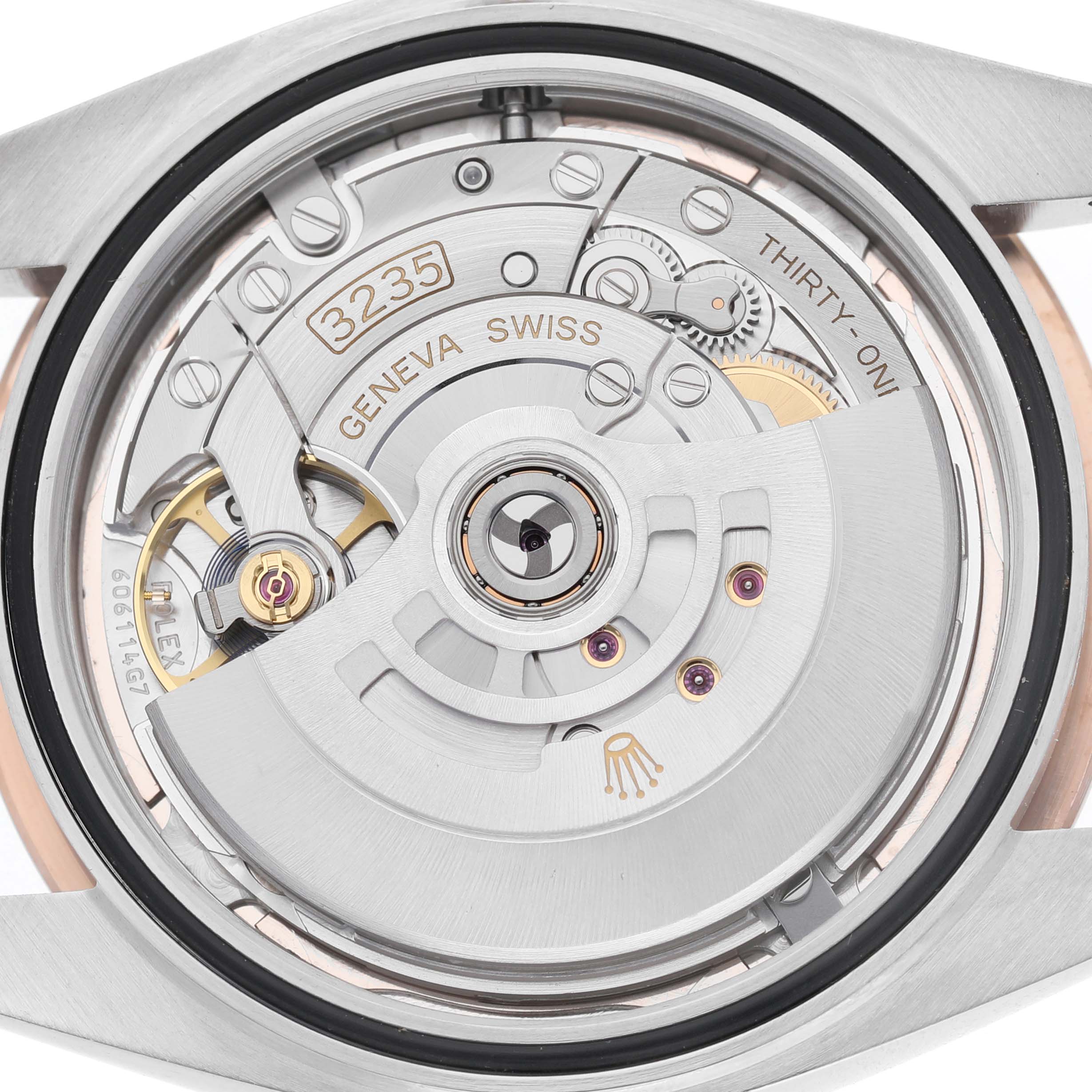 This image shows the Rolex Datejust 41 126331 Men's Steel and Gold (two tone) Pink Dial's movement from the back, highlighting the rotor and intricate mechanical details.