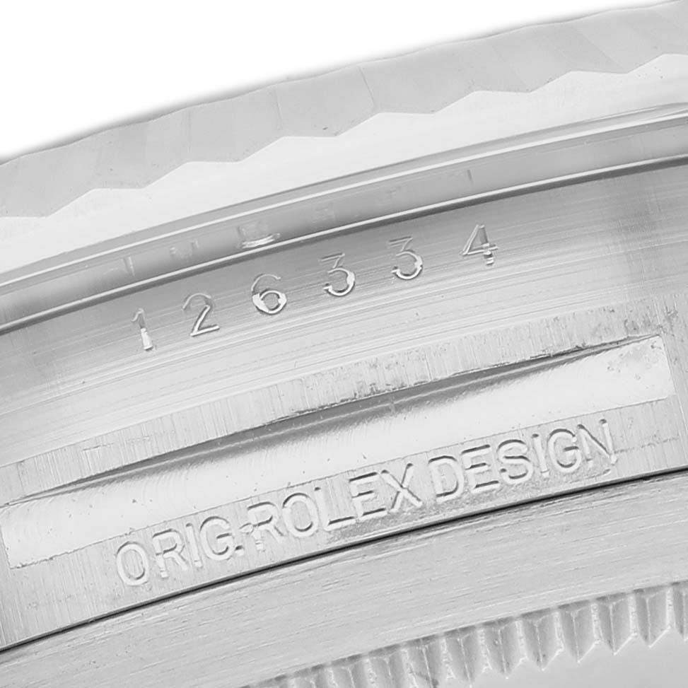 The image shows a close-up of the side of the Rolex Datejust 41 126334 Men's Stainless Steel Green Dial, highlighting the model number and "ORIG ROLEX DESIGN" engraving.