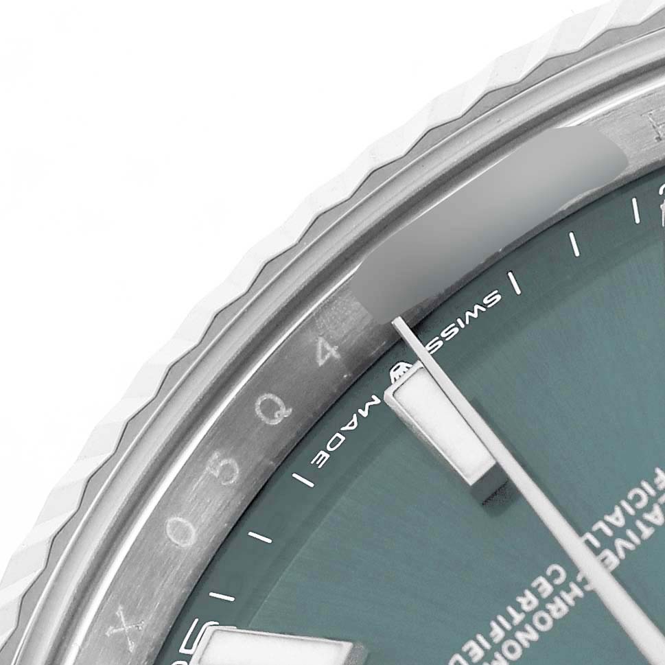 The image shows a close-up of the Rolex Datejust 41 126334 Men's Stainless Steel Green Dial's dial, focusing on the edge of the bezel and part of the dial text.