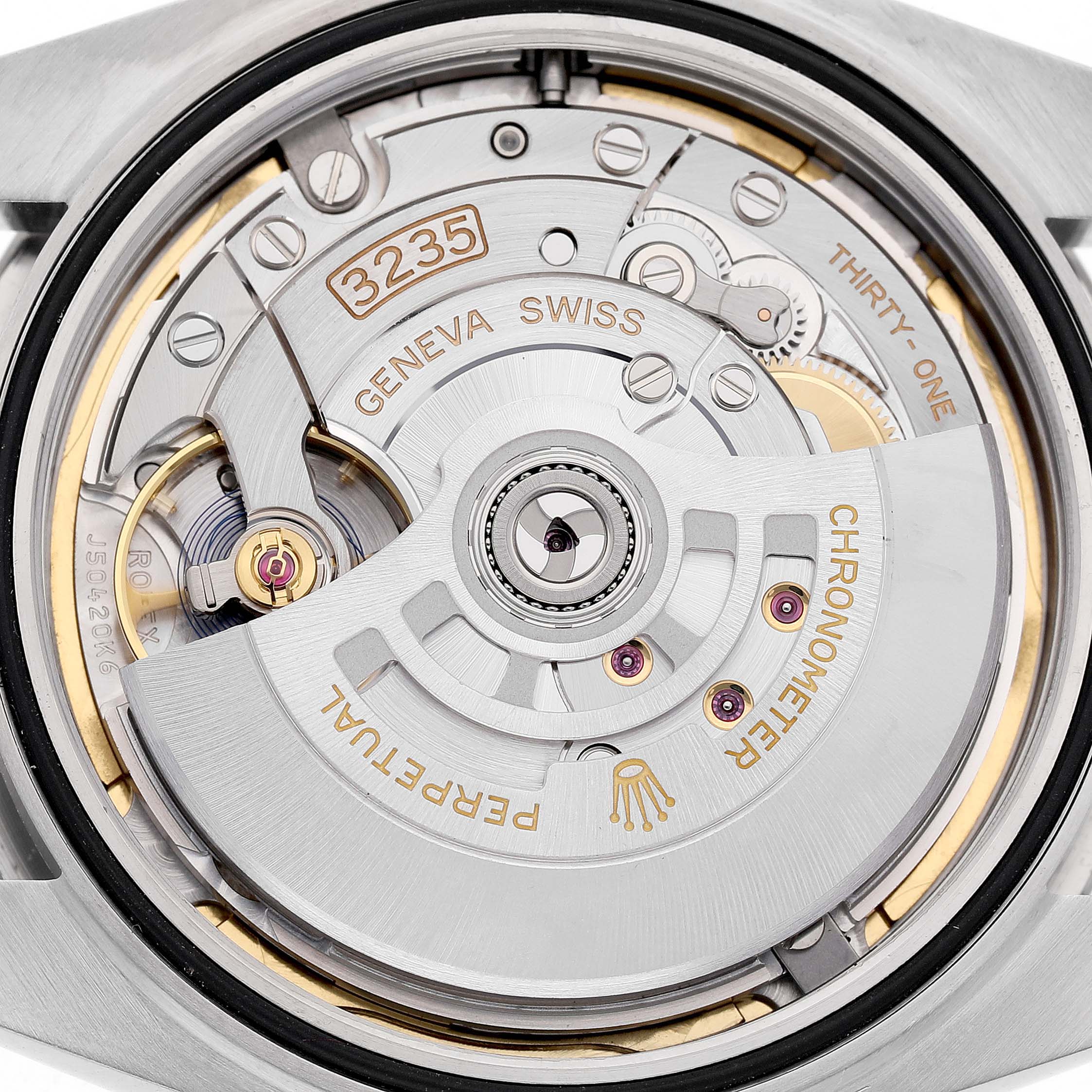 The image shows the Rolex Datejust 41 126334 Men's Stainless Steel Green Dial's movement from the back, revealing the intricate mechanics and rotor.