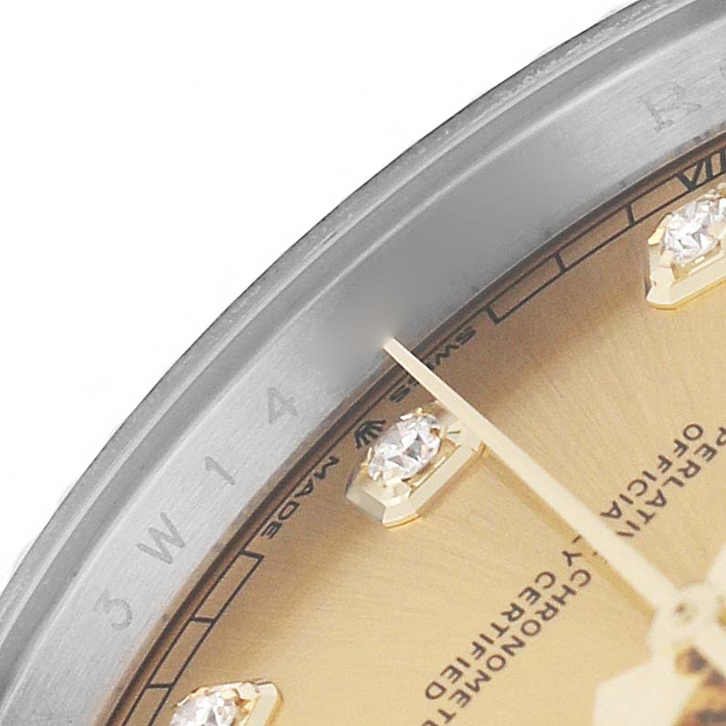 The image shows a close-up of the bezel and part of the dial with markers of a Rolex Datejust 41 126333 Men's Steel and Gold (two tone) Champagne Dial.
