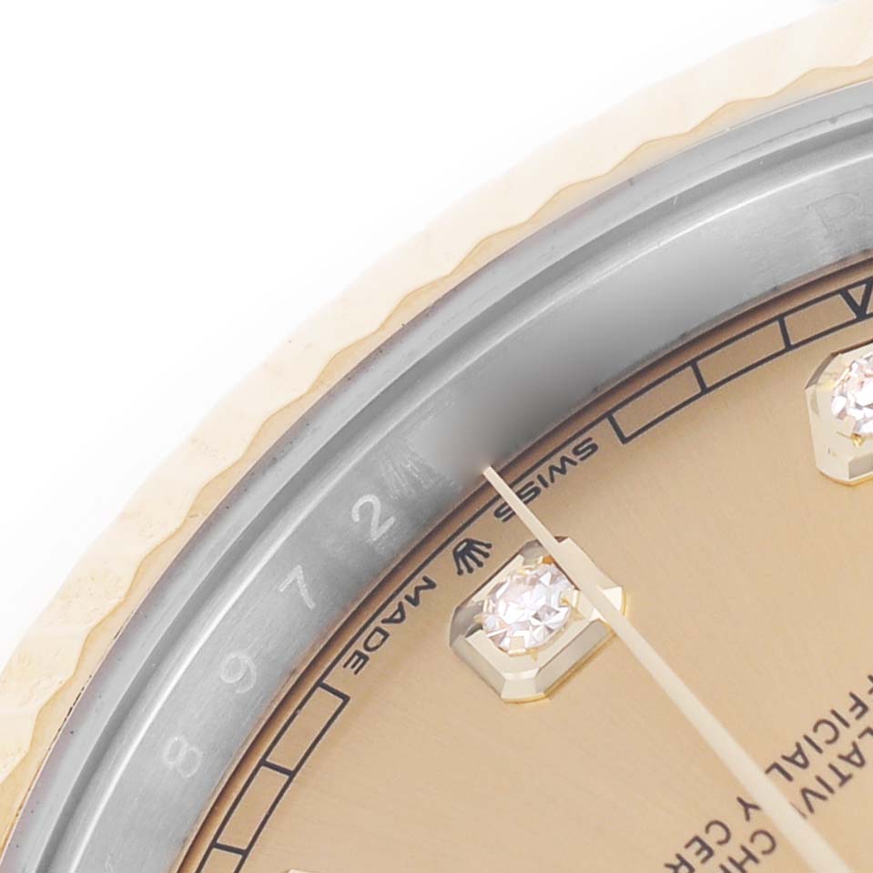 The image shows a close-up of the dial and bezel of the Rolex Datejust 41 12633 Men's Steel and Gold (two tone) Champagne Dial, featuring the diamond hour markers.