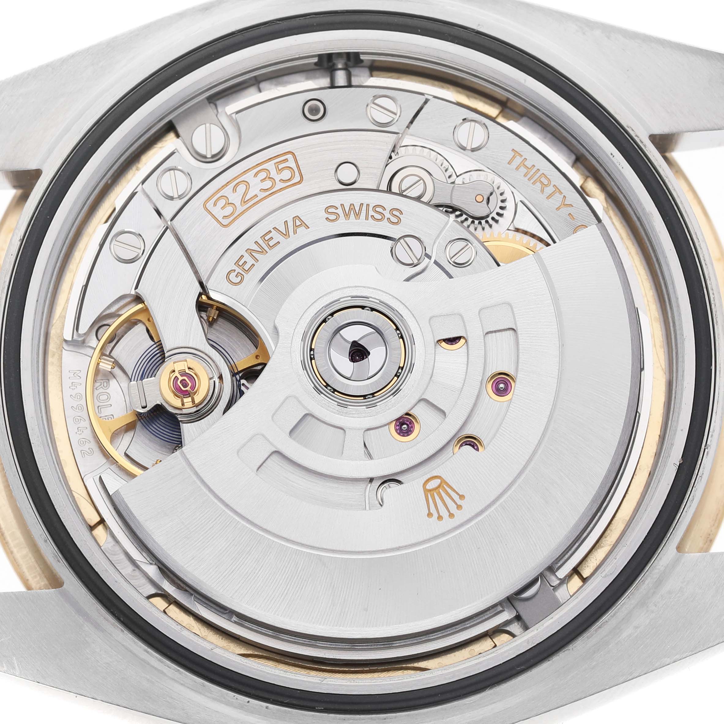 The image shows the movement mechanism of a Rolex Datejust 41 12633 Men's Steel and Gold (two tone) Champagne Dial, focusing on its intricate components from a rear angle.