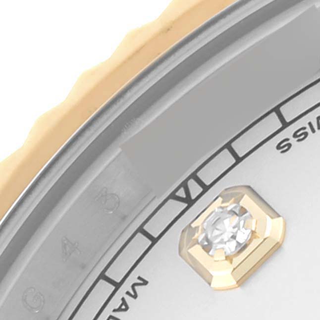 This close-up of the Rolex Datejust 41 116333 Men's Steel and Gold (two tone) Silver Dial 116333 Men's Steel and Gold (two tone) Silver Dial shows the bezel, part of the dial, and a diamond hour marker.