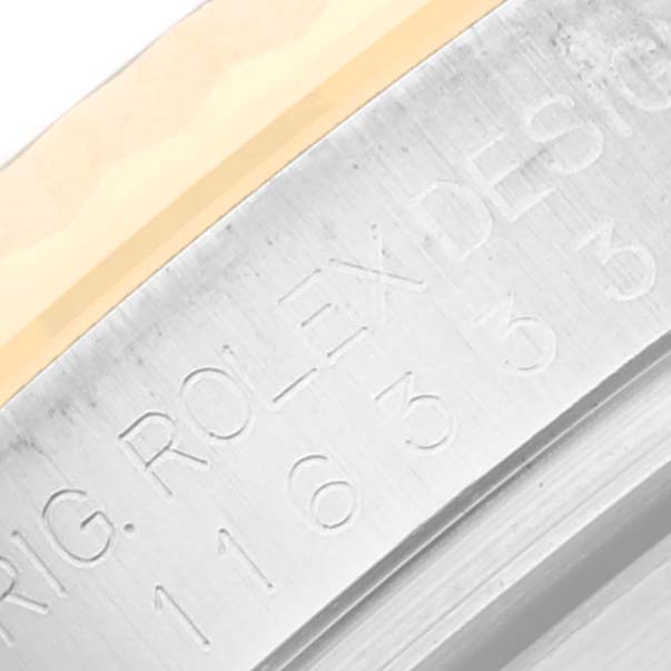 This close-up image shows the bezel and part of the engraved rehaut of a Rolex Datejust 41 116333 Men's Steel and Gold (two tone) Silver Dial 116333 Men's Steel and Gold (two tone) Silver Dial watch.