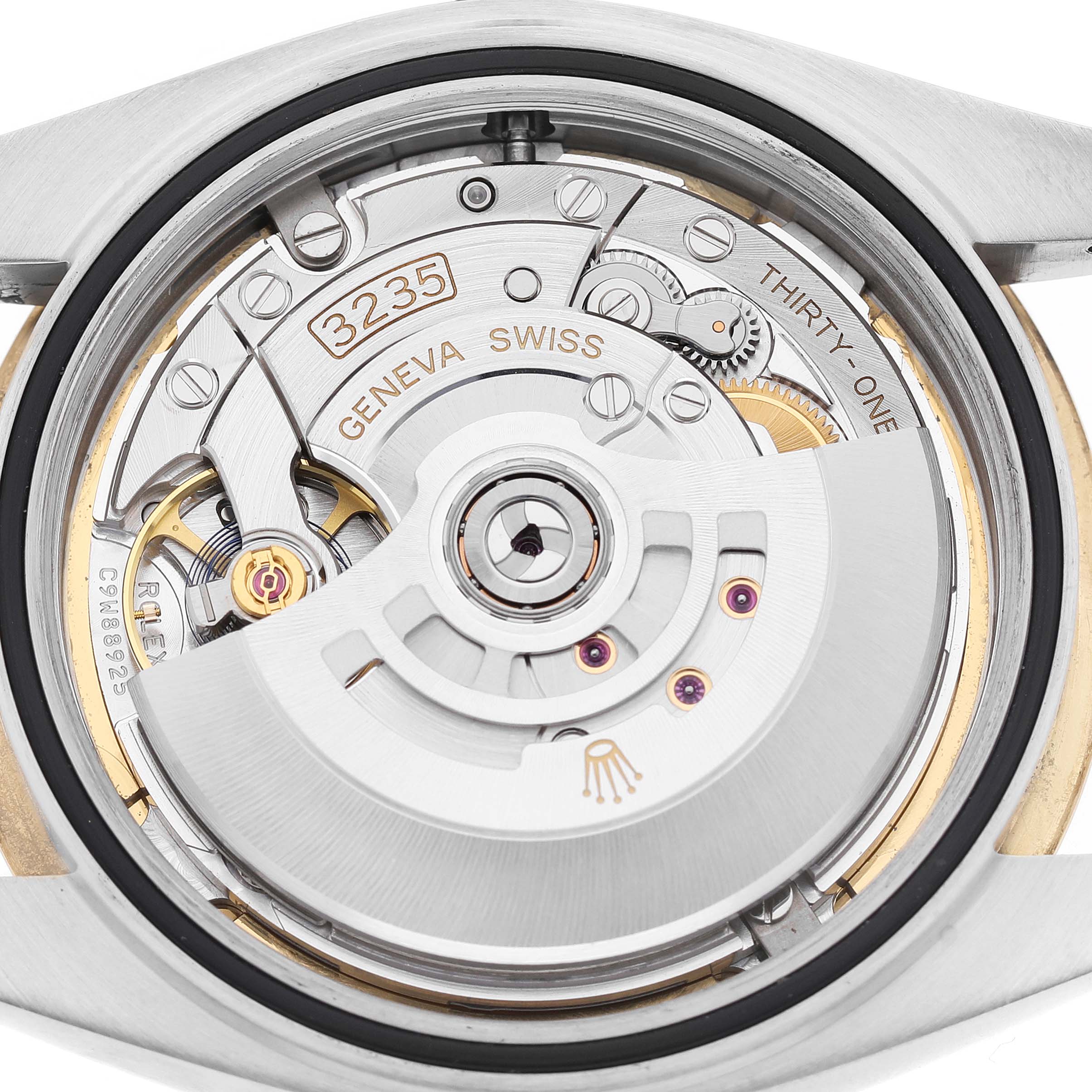 The image shows the movement of a Rolex Datejust 41 126333 Men's Steel and Gold (two tone) White Dial from a rear angle, highlighting the intricate mechanics and rotor.