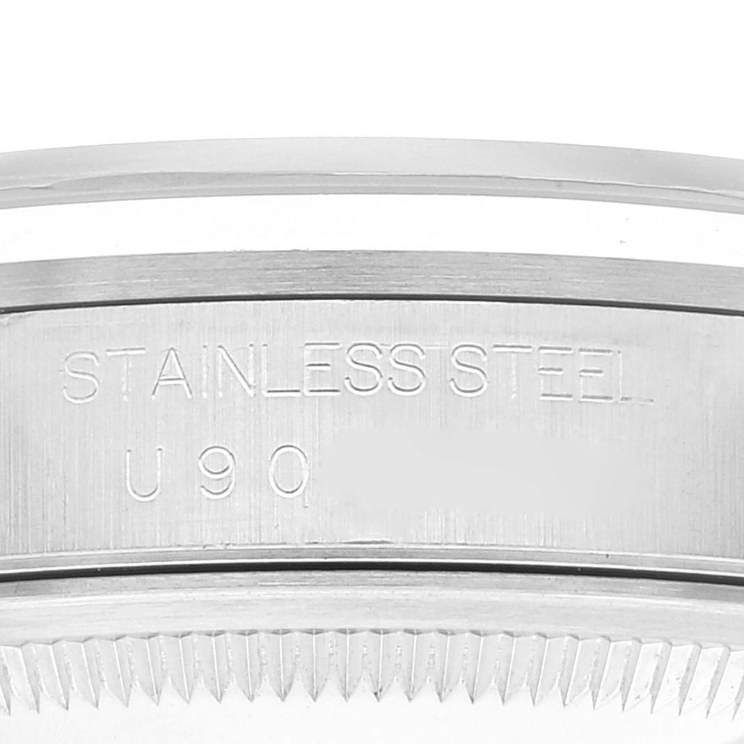 This is a close-up of the case side of a Rolex Datejust 16200 Men's Stainless Steel Black Dial 16200 Men's Stainless Steel Black Dial watch, highlighting the "Stainless Steel" engraving and reference number.