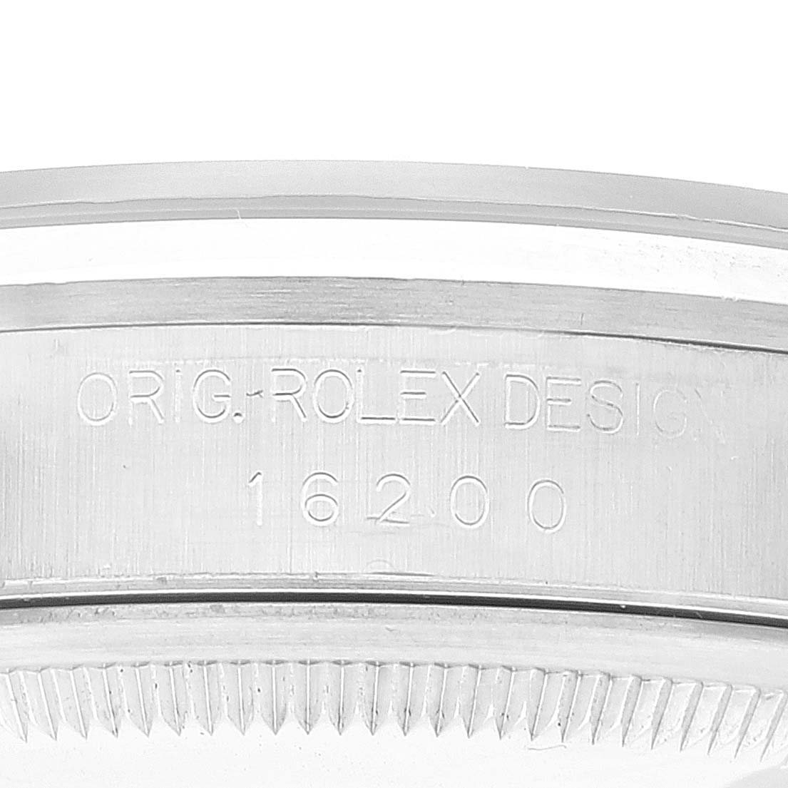 This image shows the side view of the case of a Rolex Datejust 16200 Men's Stainless Steel Black Dial 16200 Men's Stainless Steel Black Dial watch, emphasizing the serial number and text engraving.