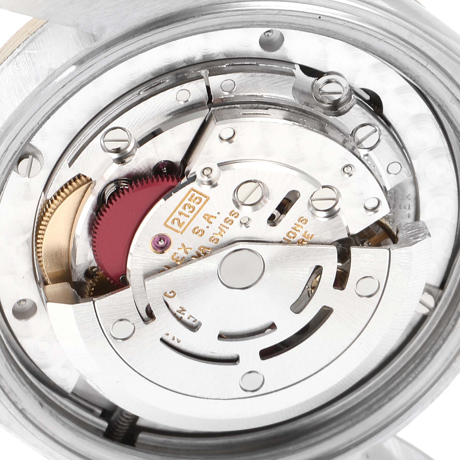 This is a close-up of the internal mechanism of a Rolex Mid-Size 68273 Women's Steel and Gold (two tone) Grey Dial 68273 Women's Steel and Gold (two tone) Grey Dial model watch, showing the automated movement components.