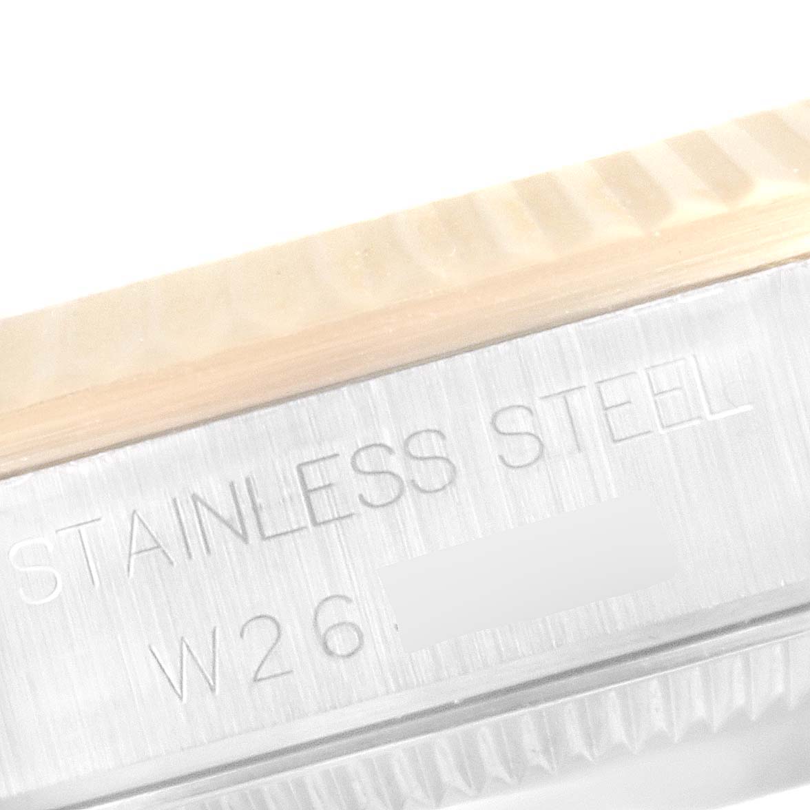 The image shows a close-up of the engraved stainless steel case side of a Mid-Size Rolex watch.