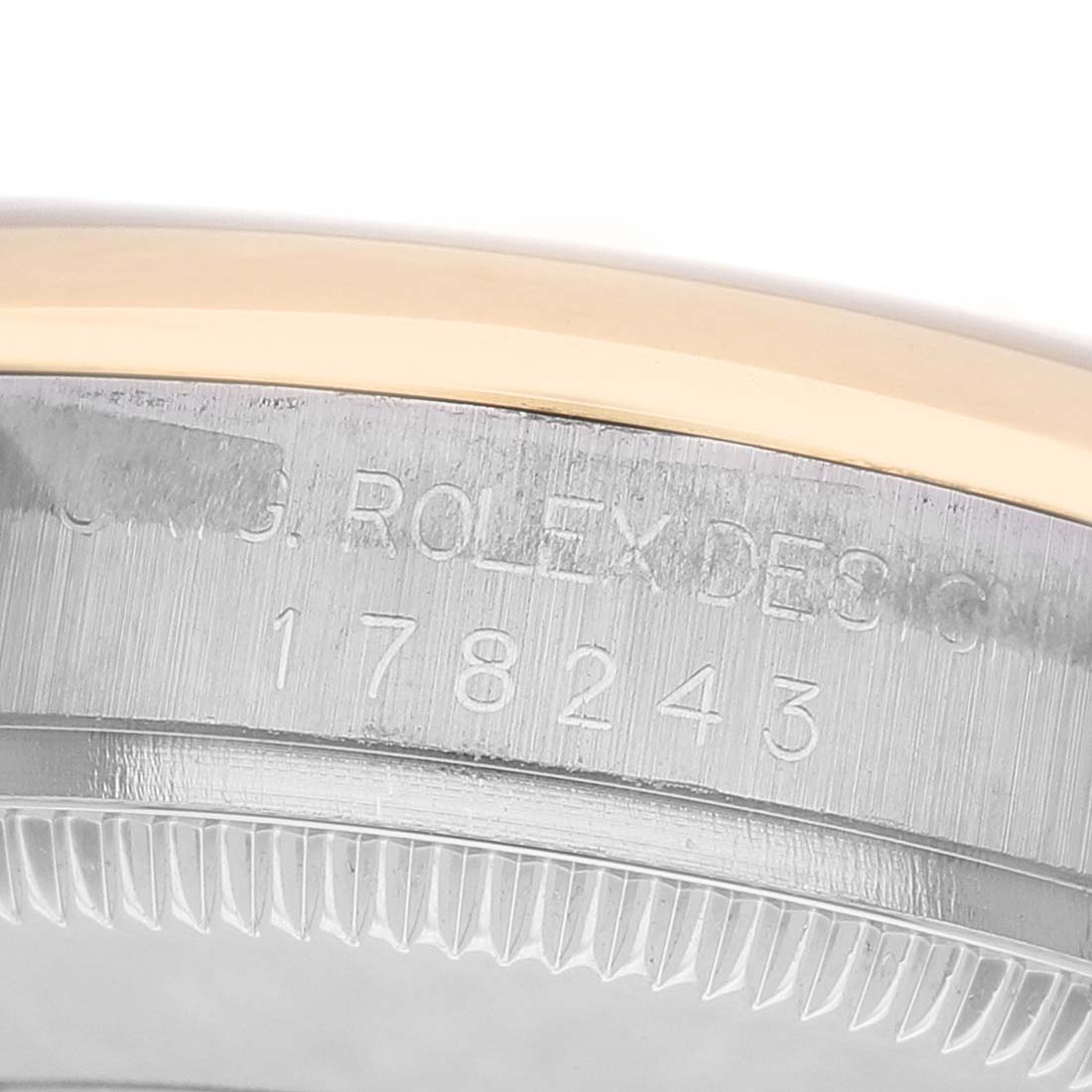 The image shows a close-up of the side of a Rolex Mid-Size 178243 Women's Steel and Gold (two tone) Champagne Dial watch, highlighting the model number and part of the bezel.