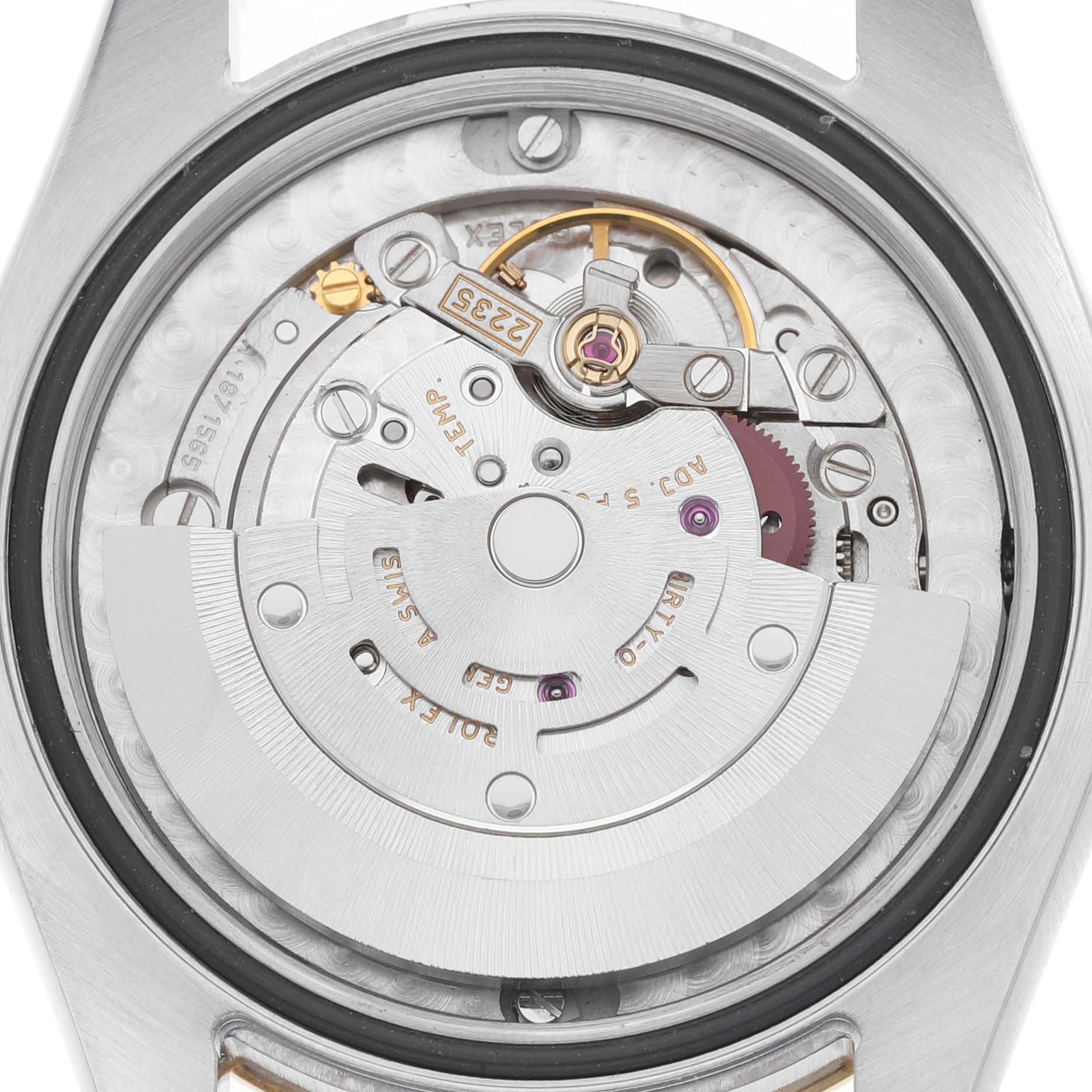 The image shows the movement from a rear angle, displaying the intricate mechanics of a Rolex Mid-Size 178243 Women's Steel and Gold (two tone) Champagne Dial model watch.