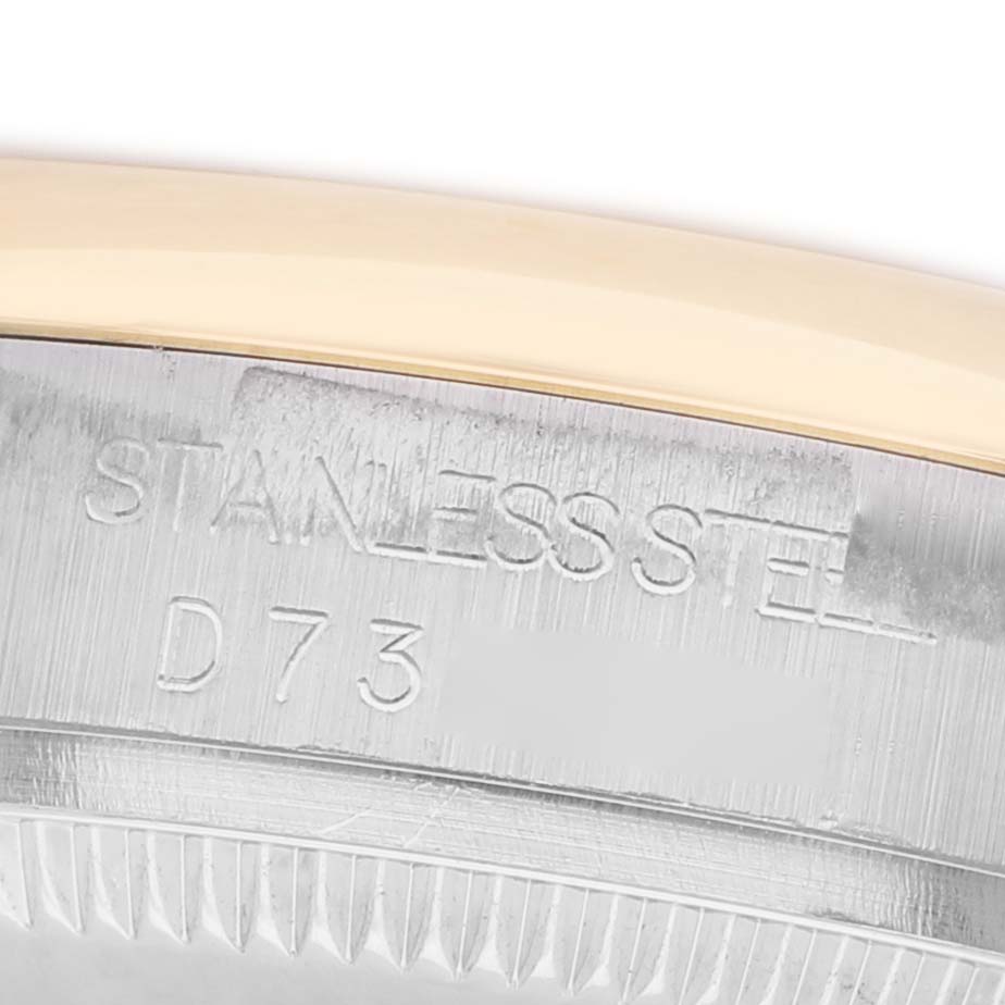 The image shows a close-up of the stainless steel bezel engravings on a Rolex Mid-Size 178243 Women's Steel and Gold (two tone) Champagne Dial watch.