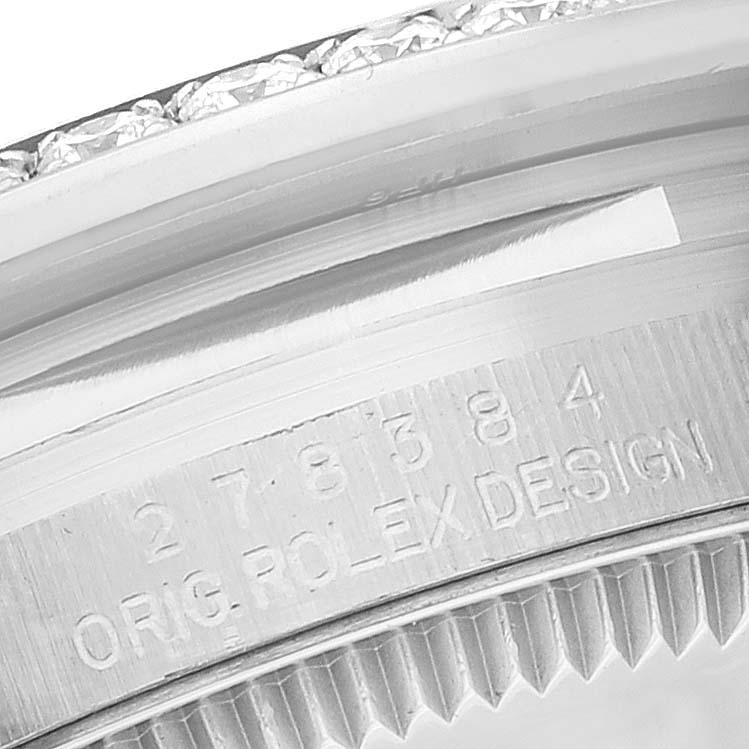 The image shows the serial number and "ORIG. ROLEX DESIGN" engraving on the caseback of the Mid-Size Rolex watch.