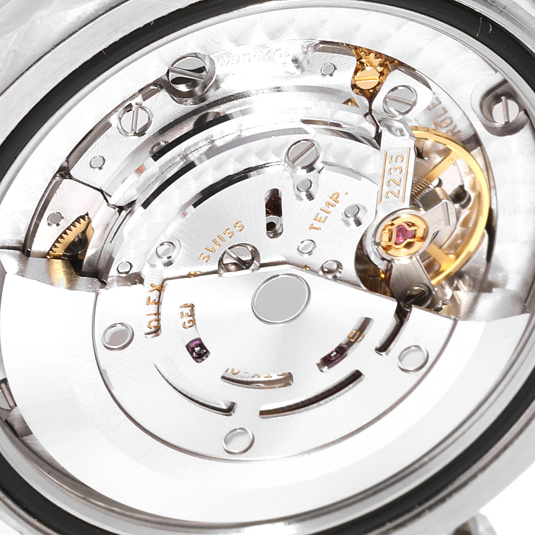 The image shows a close-up view of the internal mechanism of a Mid-Size Rolex watch.