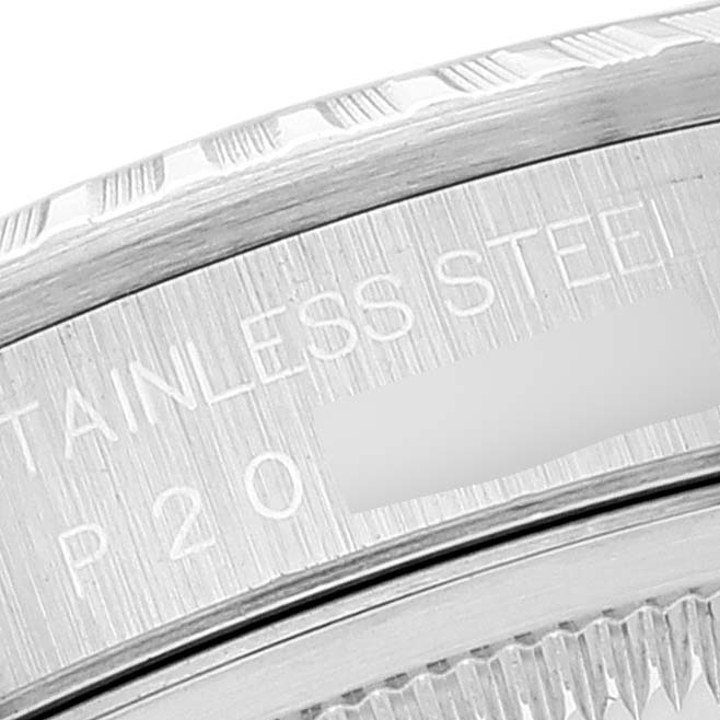 This is a close-up of the side of a Rolex Datejust 16220 Men's Stainless Steel Silver Dial 16220 Men's Stainless Steel Silver Dial watch, showing the stainless steel inscription and part of the bezel.