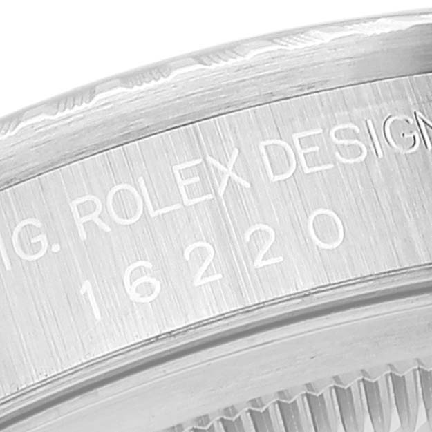 The image shows a close-up angle of the Rolex Datejust 16220 Men's Stainless Steel Silver Dial 16220 Men's Stainless Steel Silver Dial 16220 model's case back with engraved serial numbers.