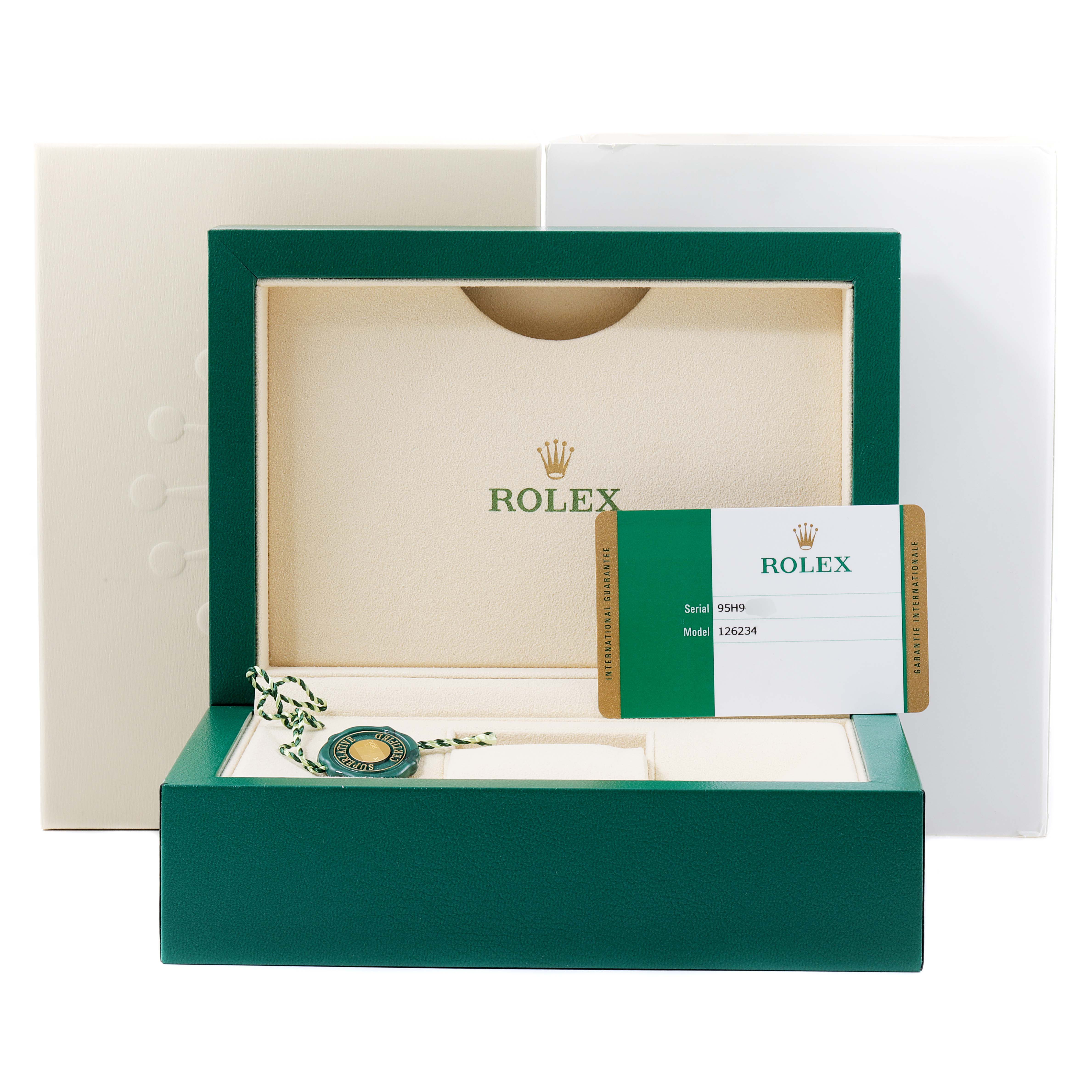 The image shows the packaging for a Rolex Datejust 126234 Men's Stainless Steel Black Dial 126234 Men's Stainless Steel Black Dial model, including the box, warranty card, and tag.