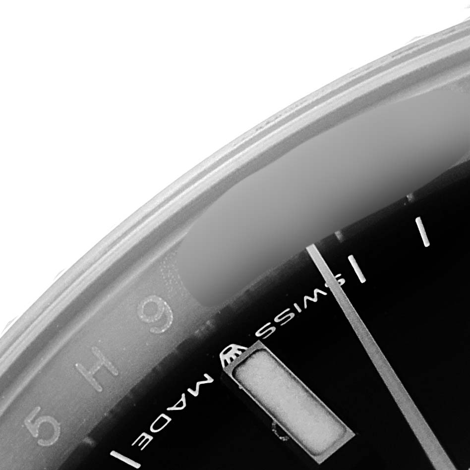 This image shows a close-up of the dial and bezel of a Rolex Datejust 126234 Men's Stainless Steel Black Dial 126234 Men's Stainless Steel Black Dial watch, highlighting the minute markers and part of the "Swiss Made" text.
