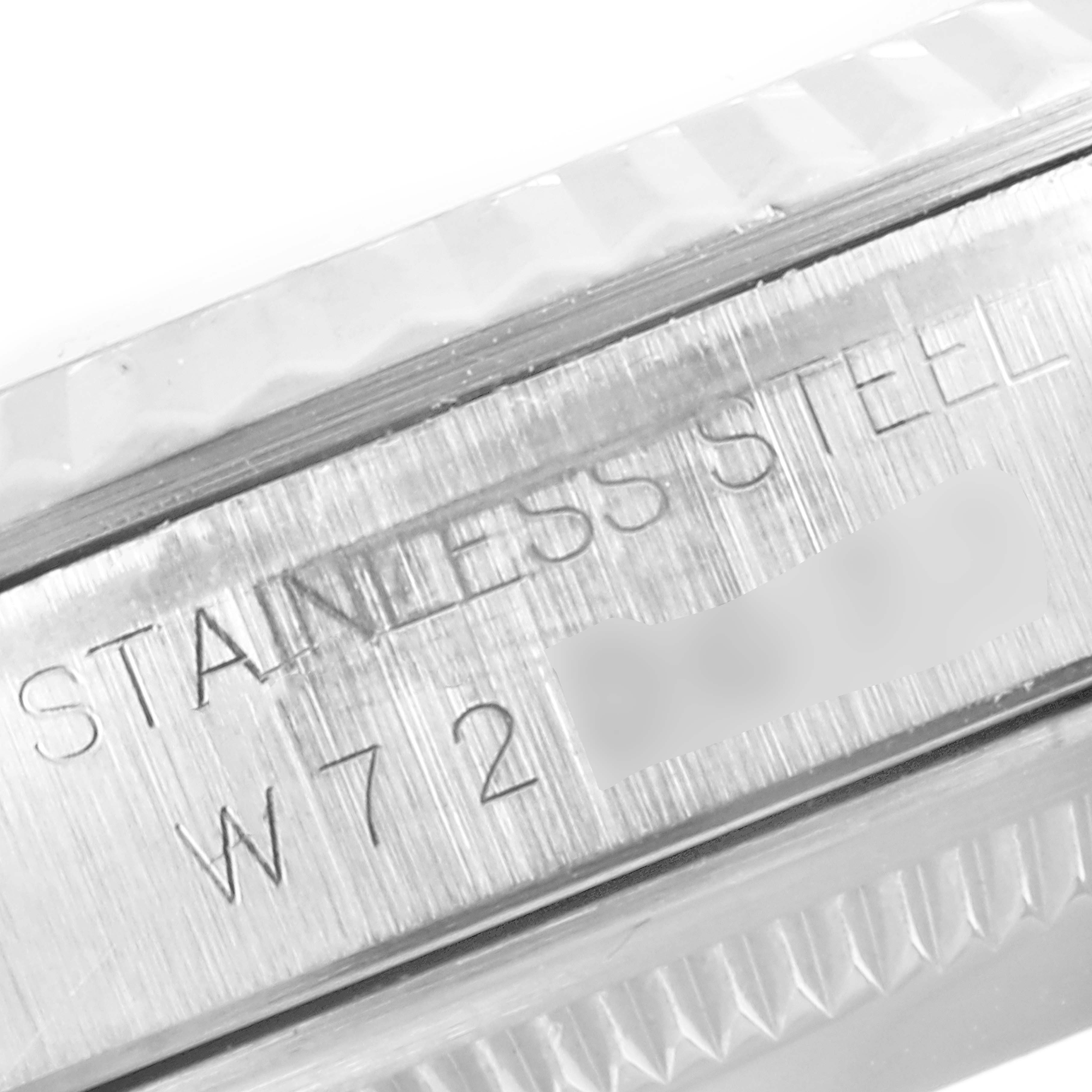 This image shows a close-up of the case side and engraving of a Rolex Datejust 16234 Men
s Stainless Steel Black Dial 16234 Men
s Stainless Steel Black Dial watch, highlighting the "STAINLESS STEEL" text.