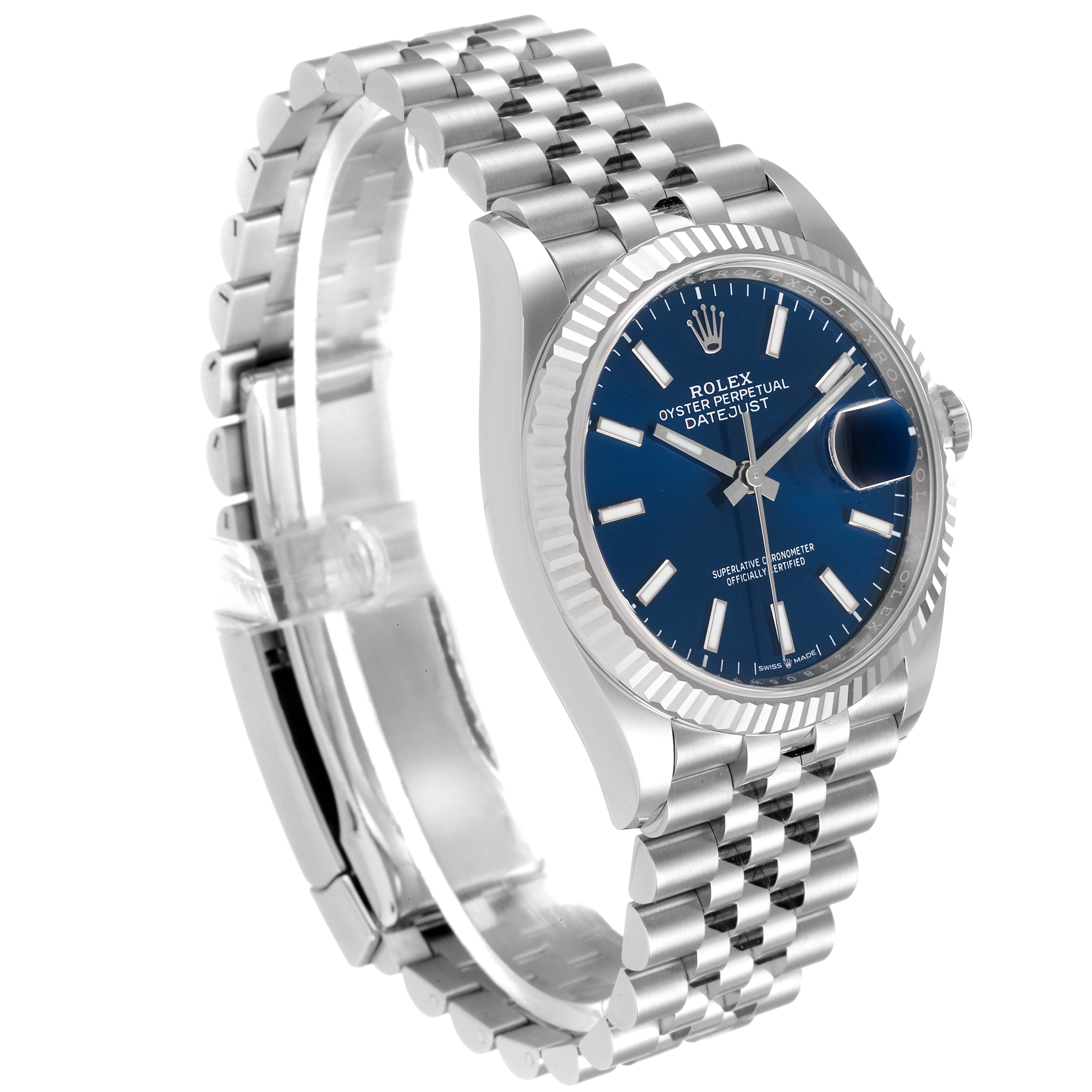 The Rolex Datejust 126234 Men's Stainless Steel Blue Dial 126234 Men's Stainless Steel Blue Dial watch is shown at an angle highlighting its blue dial, fluted bezel, and Jubilee bracelet.