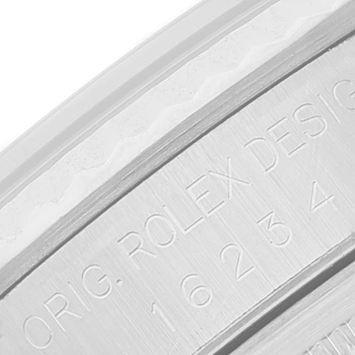 This close-up shows the engraved side of the bezel of a Rolex Datejust 16234 Men's Stainless Steel Silver Dial 16234 Men's Stainless Steel Silver Dial watch.