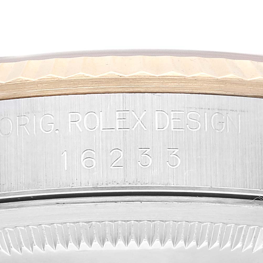 This image shows a close-up of the case side of a Rolex Datejust 16233 Men's Steel and Gold (two tone) Champagne Dial 16233 Men's Steel and Gold (two tone) Champagne Dial model, displaying the model number "16233" and "Orig. Rolex Design."