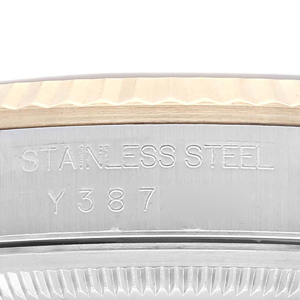 This image shows a close-up angle of the stainless steel caseback and bezel of the Rolex Datejust 16233 Men's Steel and Gold (two tone) Champagne Dial 16233 Men's Steel and Gold (two tone) Champagne Dial watch.