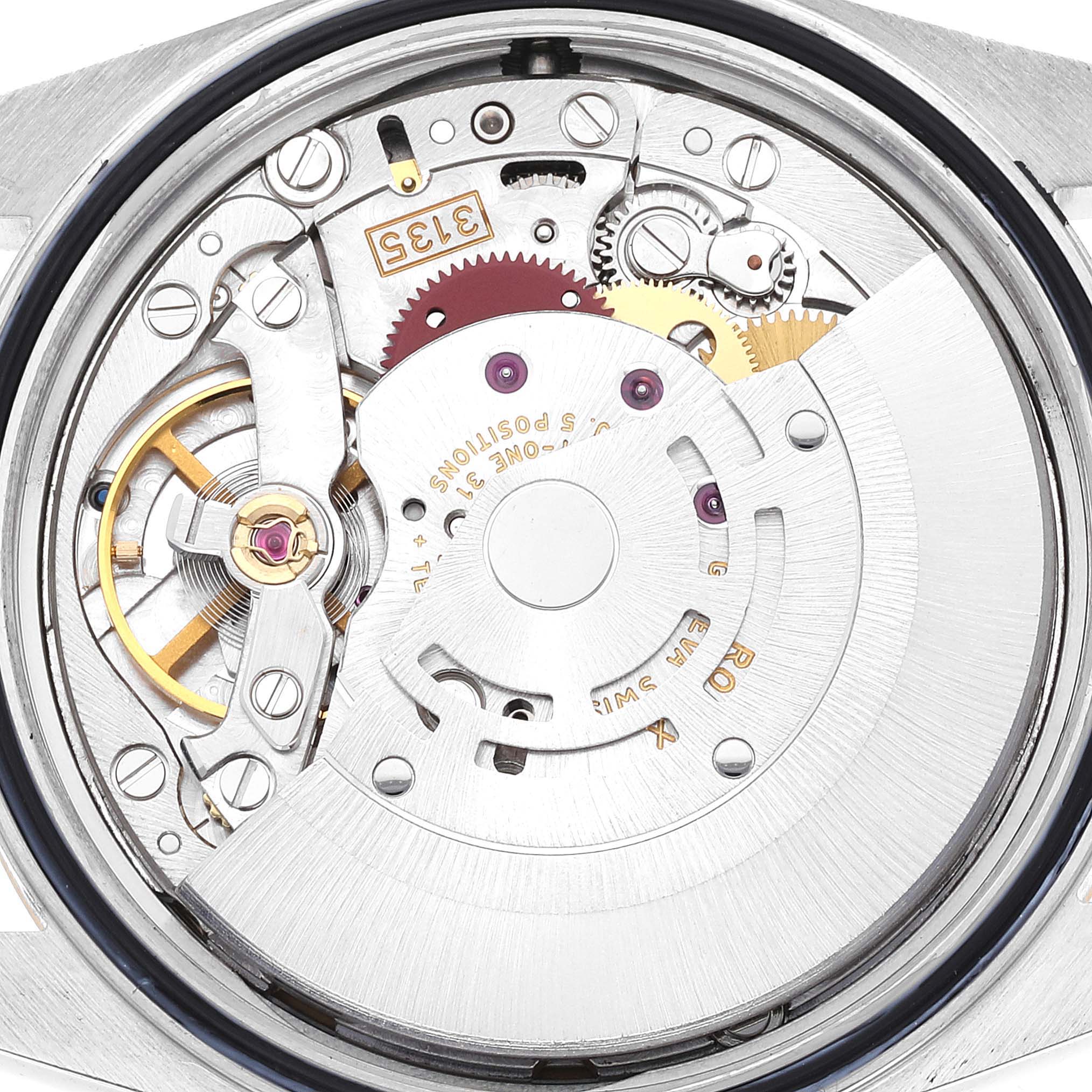 The image shows a close-up view of the movement and internal components of the Rolex Datejust 16233 Men's Steel and Gold (two tone) Champagne Dial 16233 Men's Steel and Gold (two tone) Champagne Dial watch.