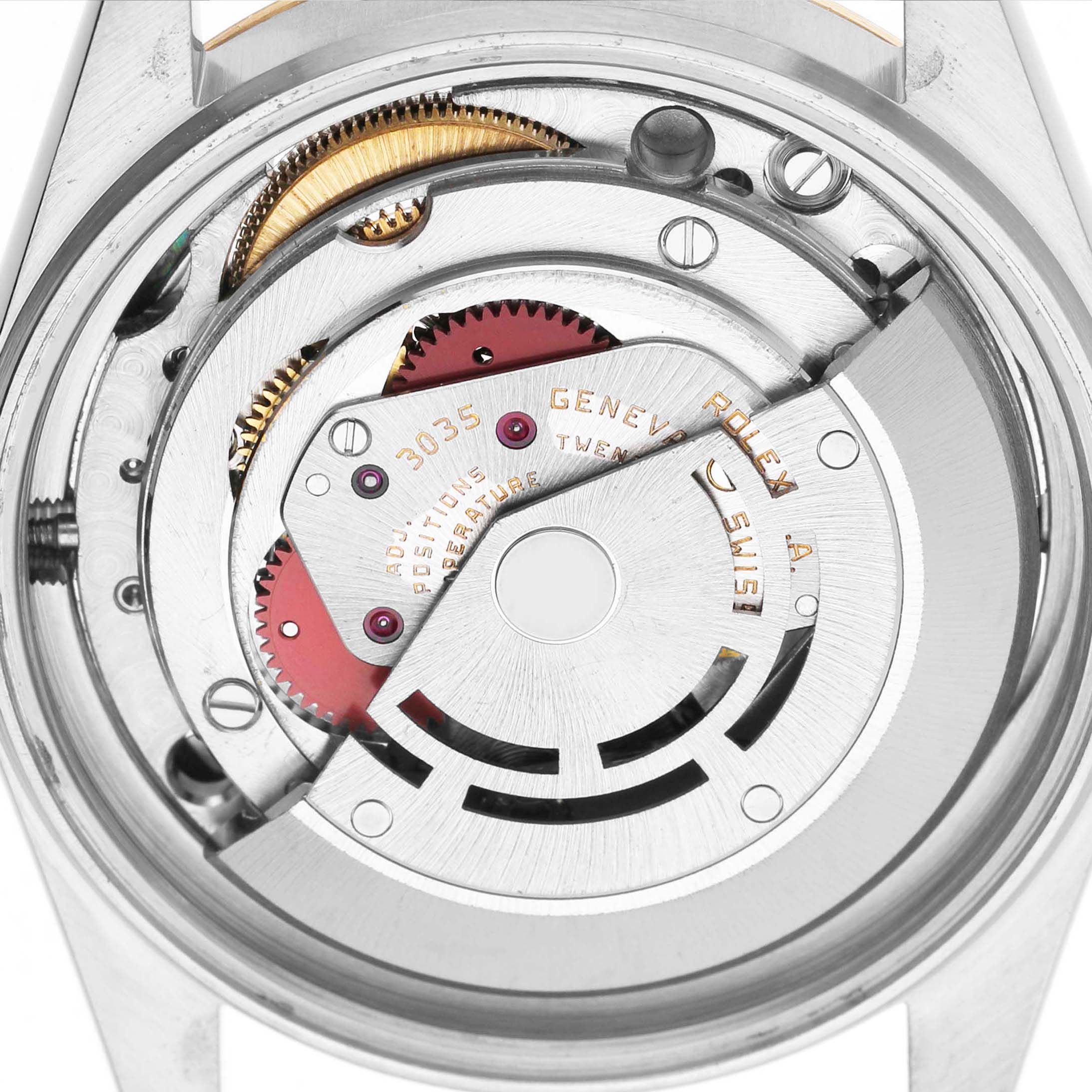 The image shows the movement of a Rolex Datejust 16013 Men's Steel and Gold (two tone) Champagne Dial watch from the back, highlighting the rotor and gears.